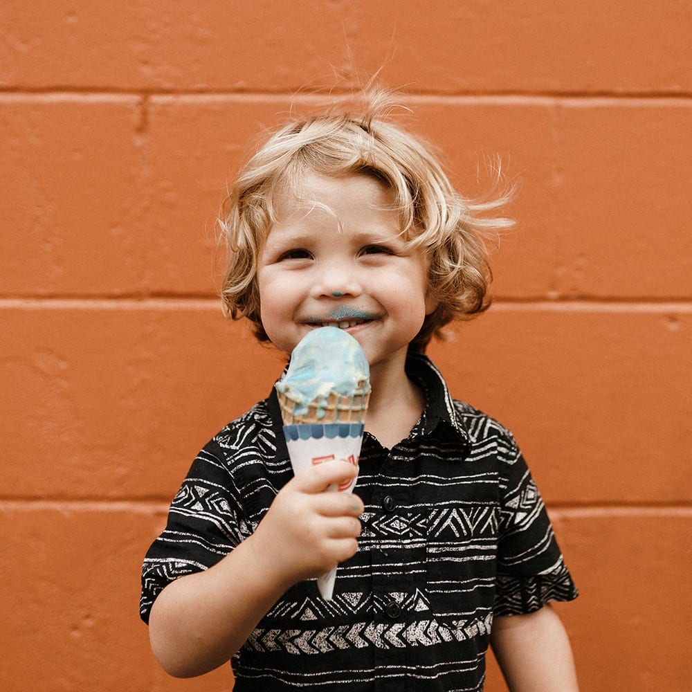 smiling child eating ice cream