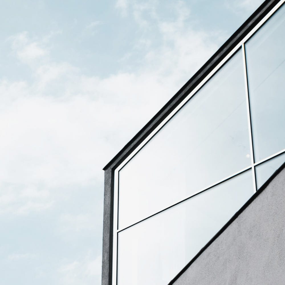 view of sky and corner window of condo building