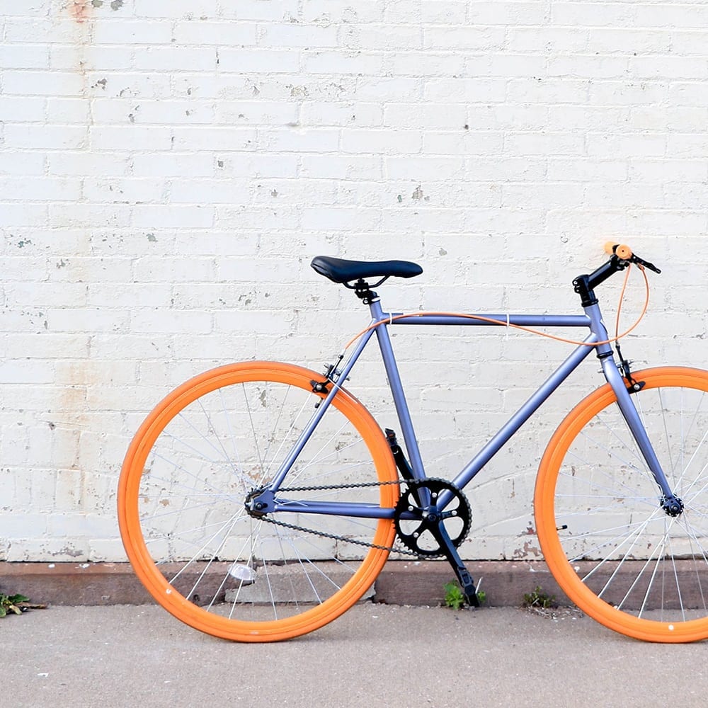 bike leaning up against wall